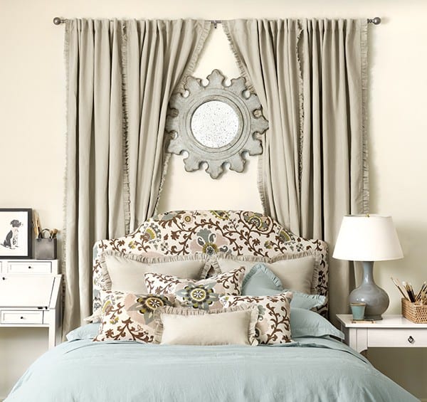 Use a mirror to create a focal point over the bed