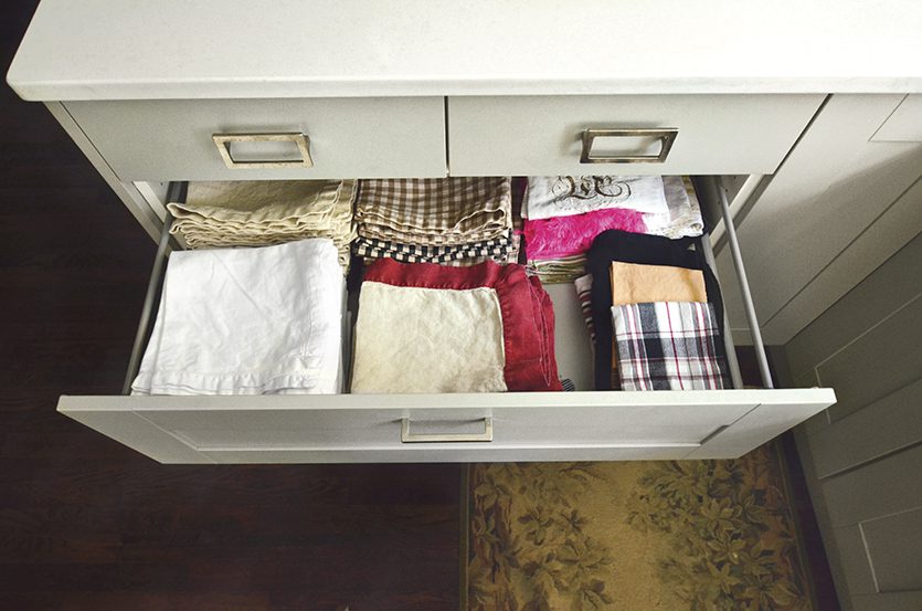 A deep drawer holds Karen's collection of dinner napkins