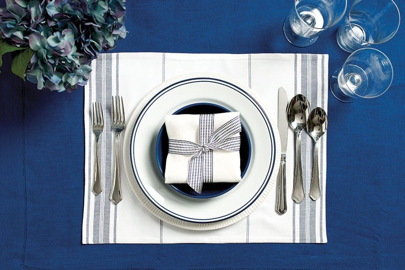 Place setting with blue table linens