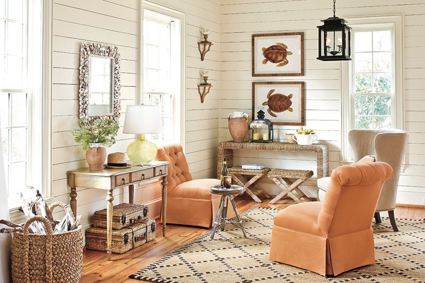 A desk in a bright, open living room