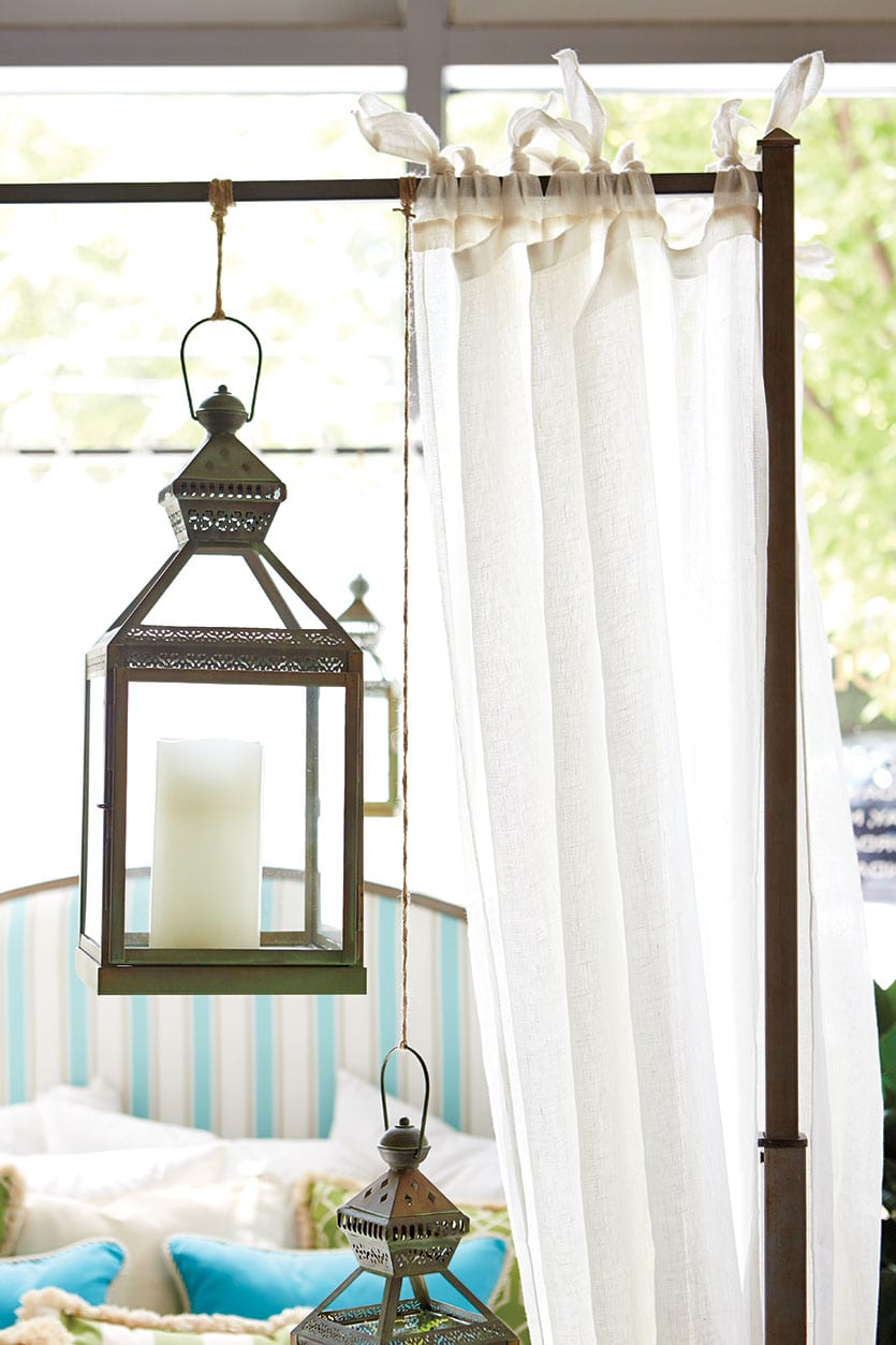 Lanterns hung from bed canopy