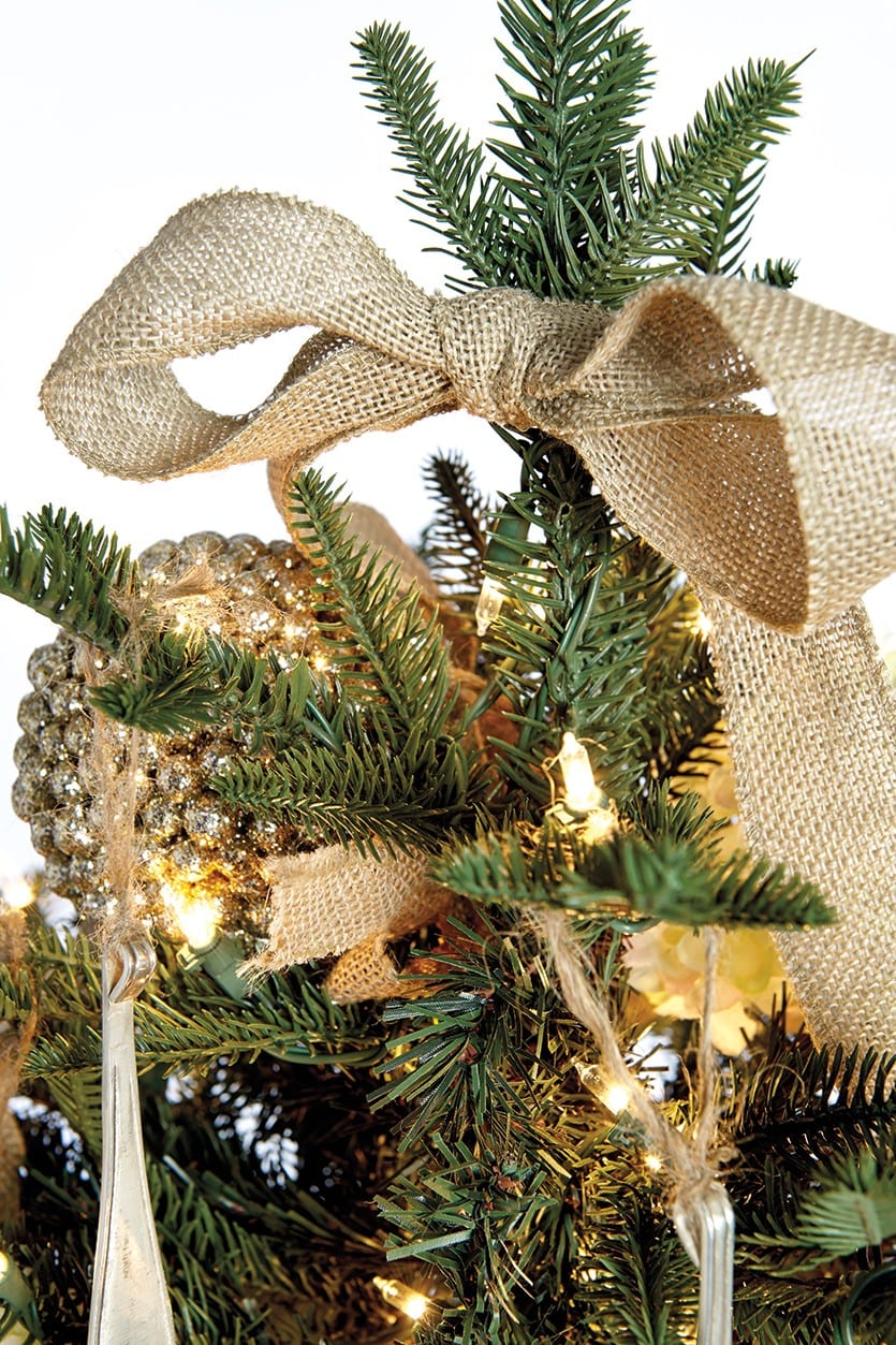 Burlap ribbon is used as a tree topper