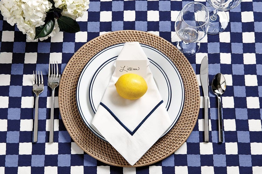 Bunny Williams' blue-and-white table cloth pairs beautifully with bright yellow