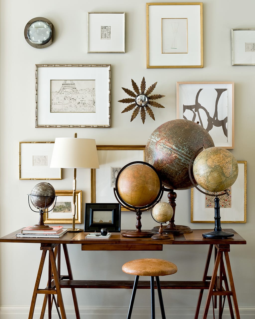 Desk with a collection of antique globes from Suzanne Kasler's new book Timeless Style