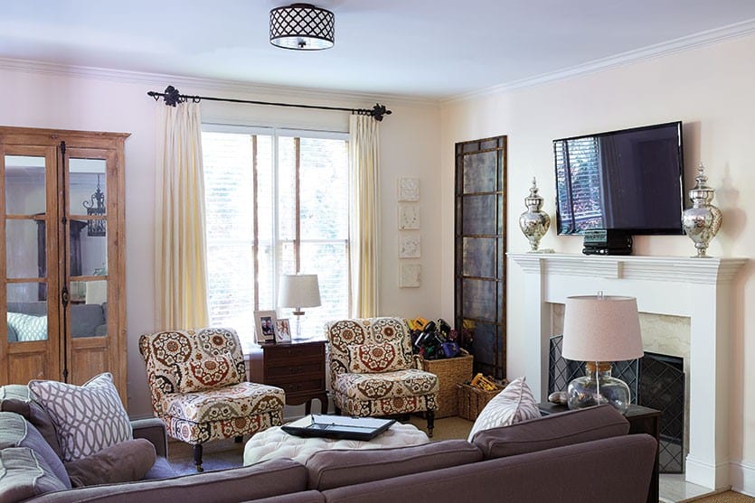 Artist Melissa Payne Baker's living room, featuring Ballard Designs chairs, mirrors, and ottoman