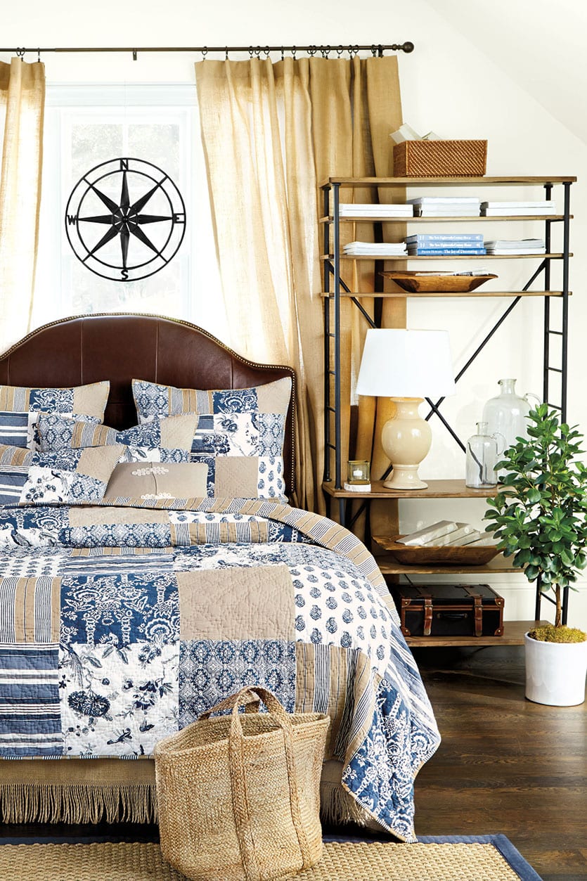 Bedroom with quilted bedding and nautical feel