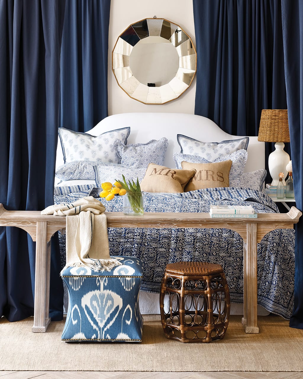 Envelope your bed in indigo drapery panels to create a cocoon