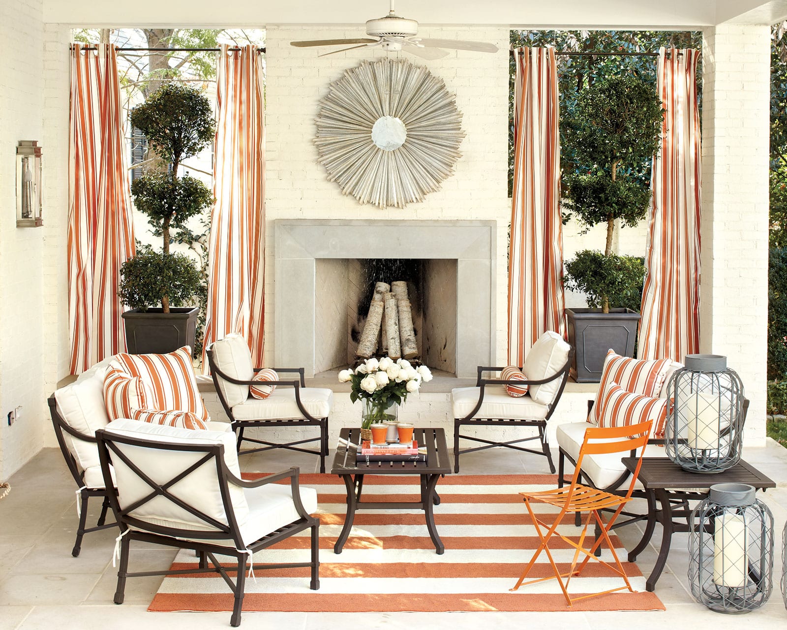 A bold stripe is used in this outdoor space, designed by Suzanne Kasler