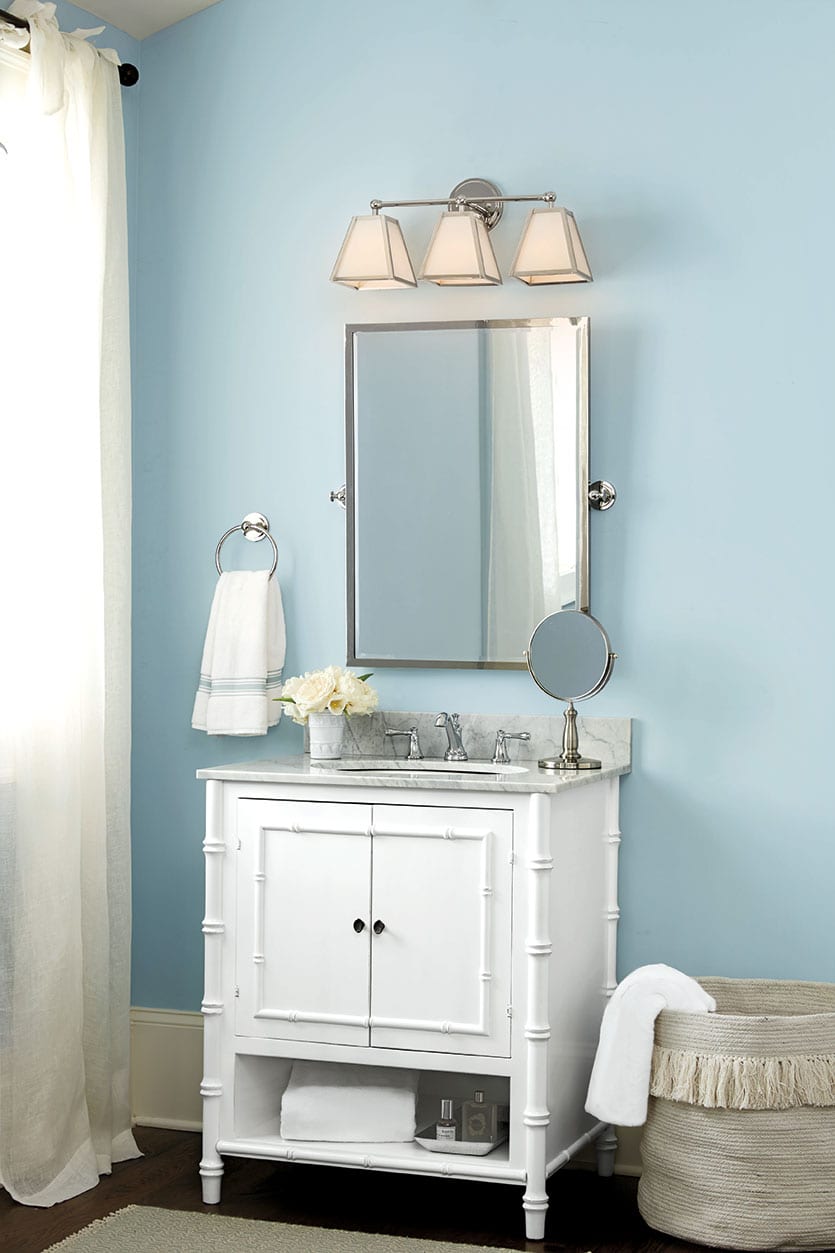 West Indies bathroom vanity with bamboo details, marble top, and polished nickel fixtures