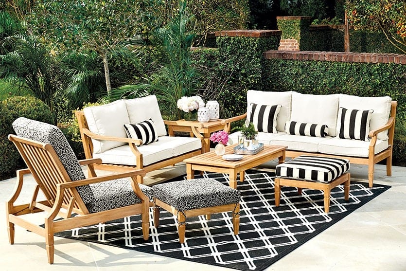 Black and white canopy stripe pillows on outdoor furniture