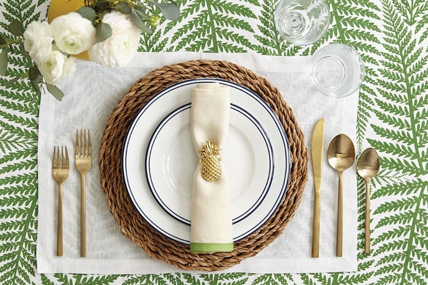 Bold prints are everywhere in fashion and home decor, so consider using them in your table setting too. We used our fern table linens to create a fun, tropical look.