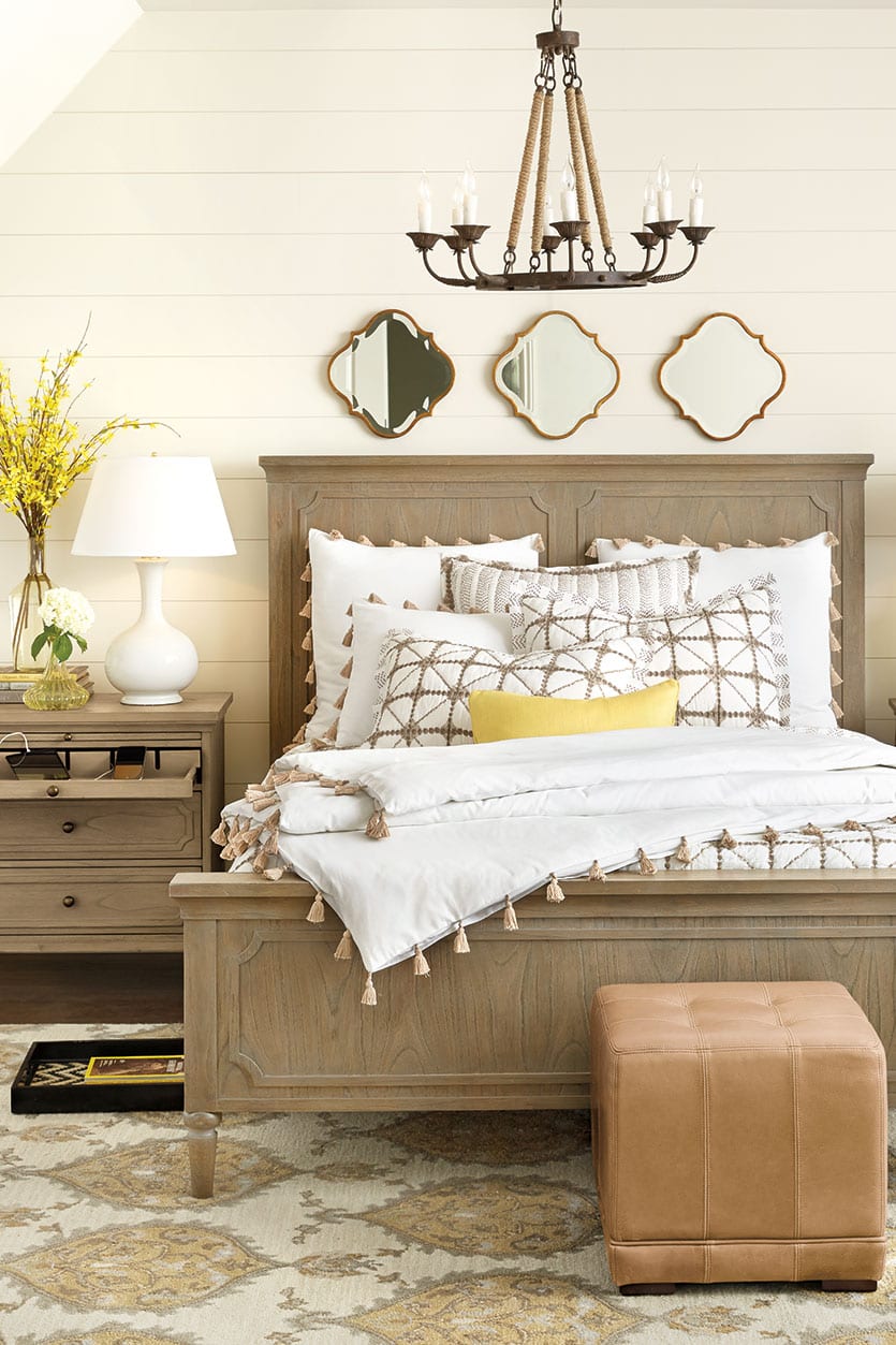 Bedroom featuring Isabella Collection, neutral bedding, and yellow accents