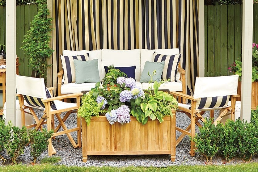 A large planter filled with seasonal plants can give your outdoor space a lush feel