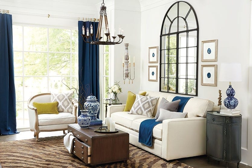 Living room with square armed sofa with animal print rug