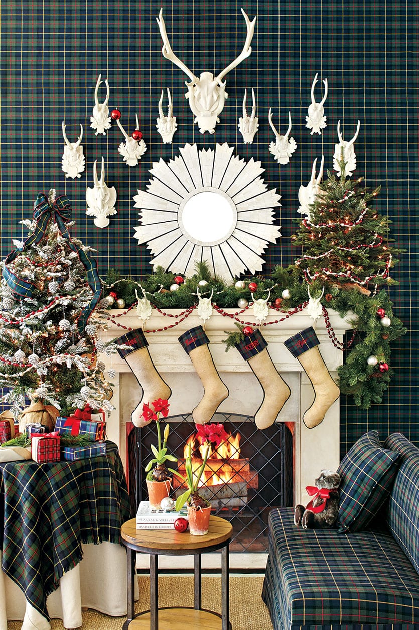 An all plaid space is brightened up with a white mirror and antlers