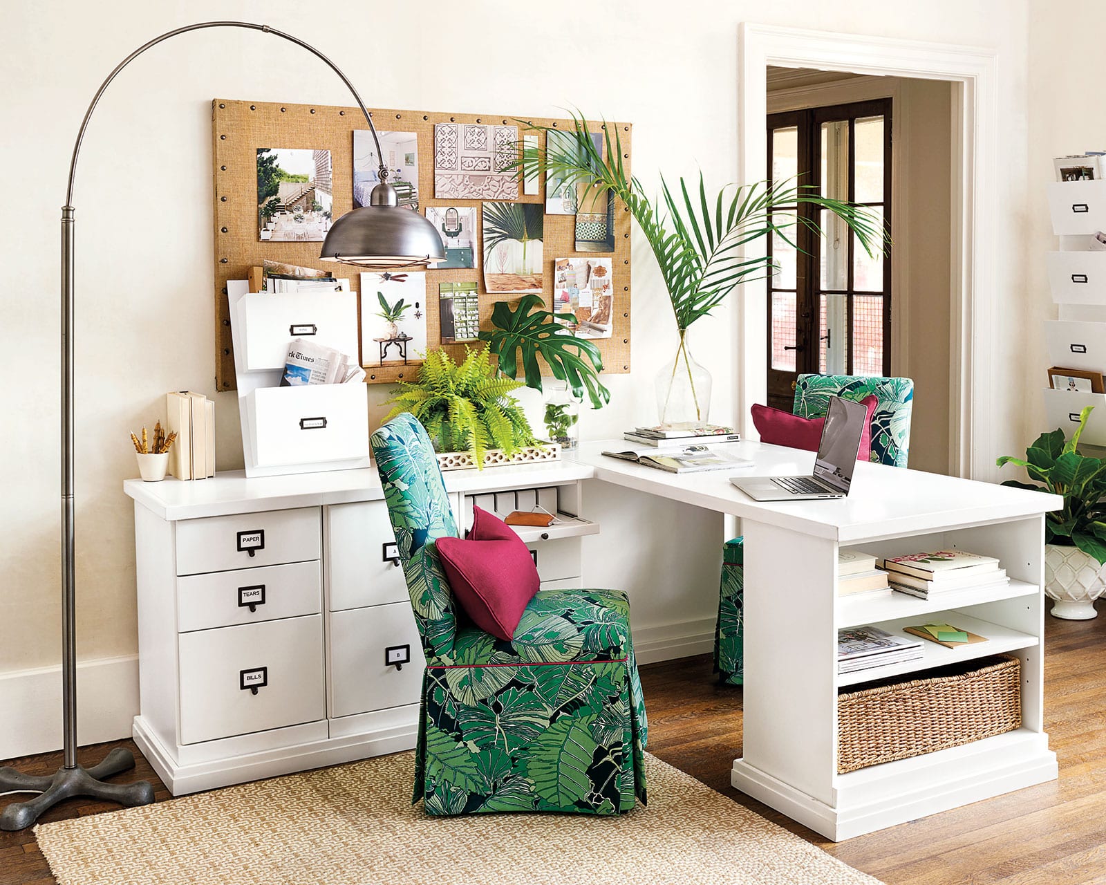 Vibrant green palm leaf print in an office from Ballard Designs