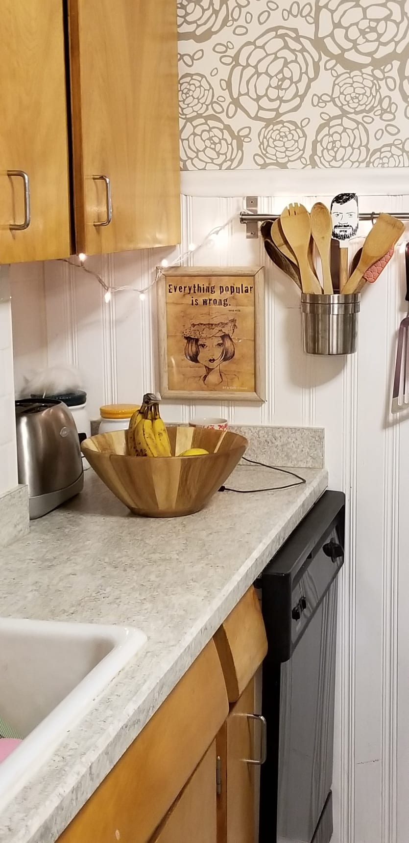 Kitchen with oak cabinets and taupe countertops