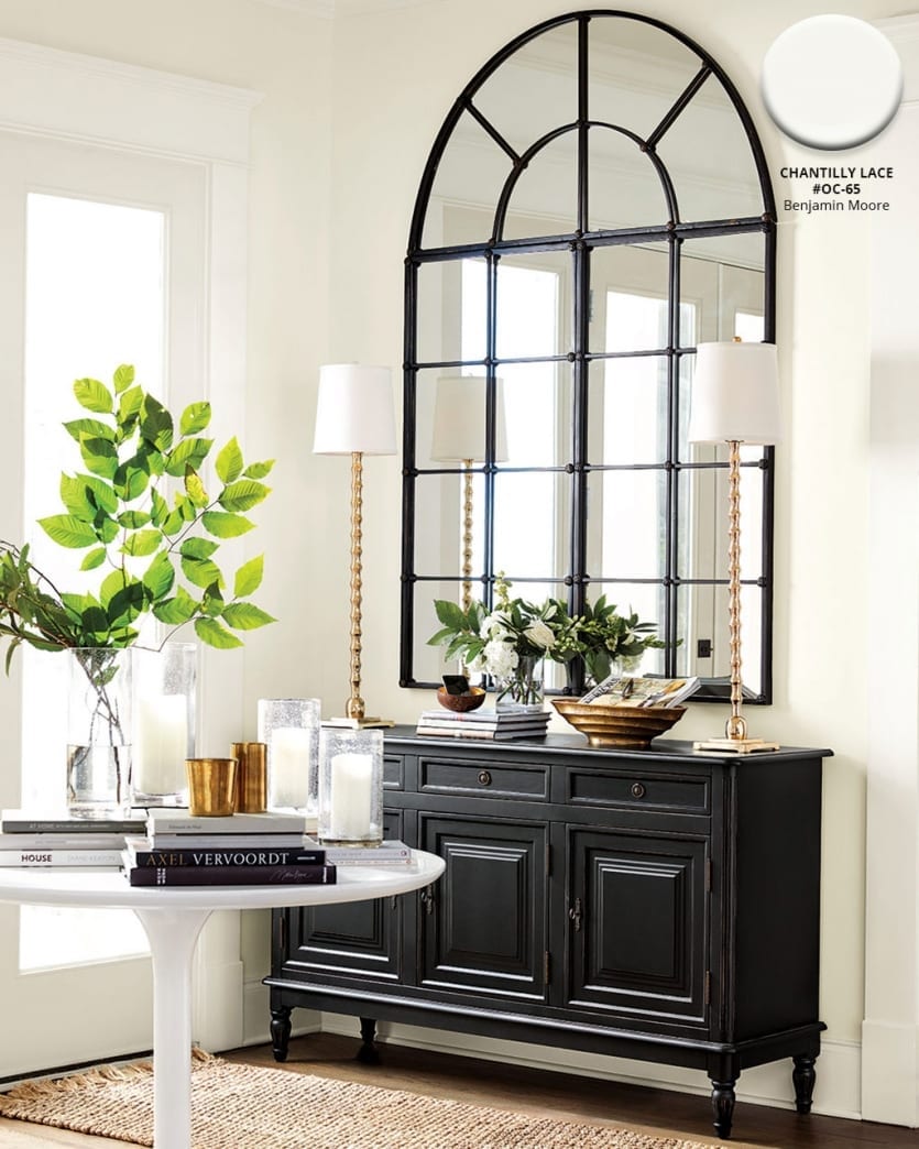 Entryway with black and white accents with a backdrop of Benjamin Moore's Chantilly Lace