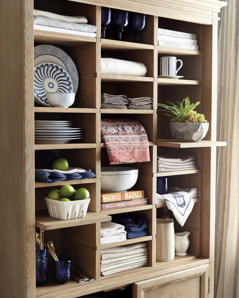 Pull out shelves to store taller items or catch the light