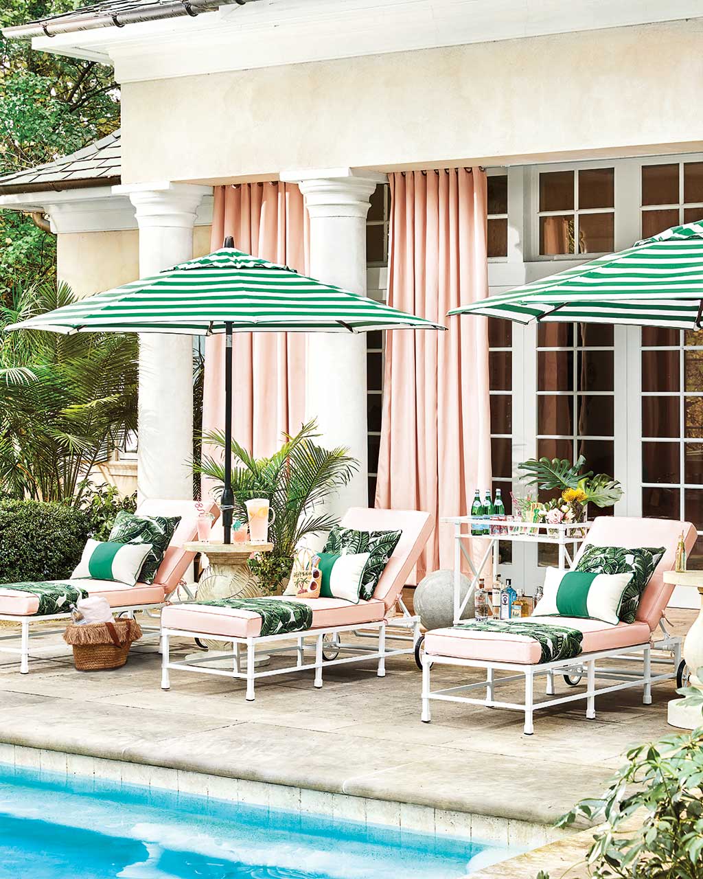 A palm printed pattern transports you to a tropical local in this poolside space | Ballard Designs