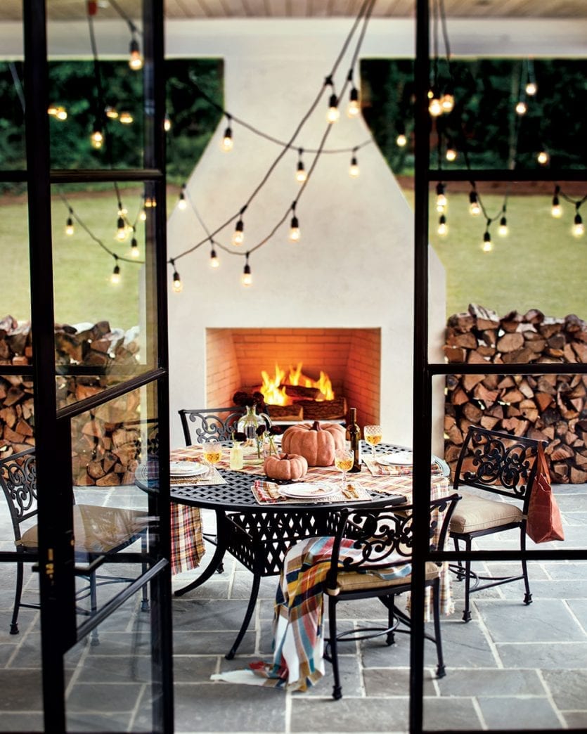 Covered patio in front of large outdoor fireplace