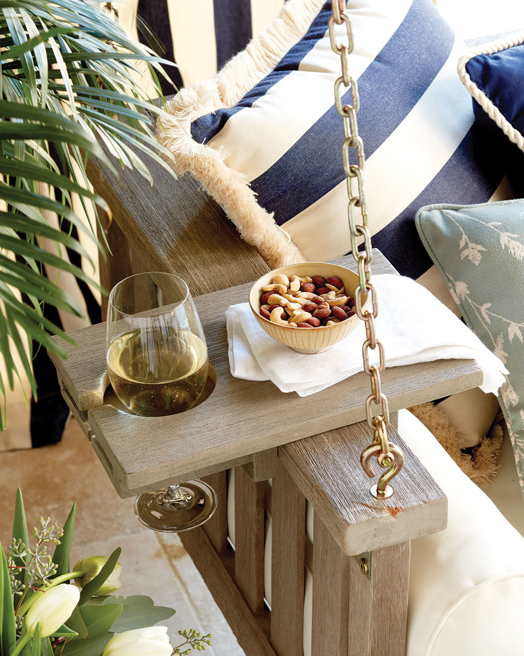 Porch swing tray table holds wine and snacks