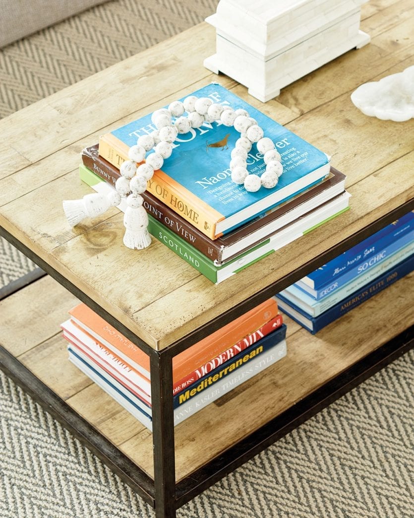 Wood coffee table with straight lines and accessories