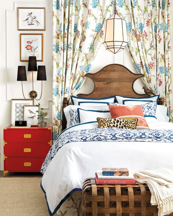 Drapery around a bed in colorful print, designed by Ballard Designs