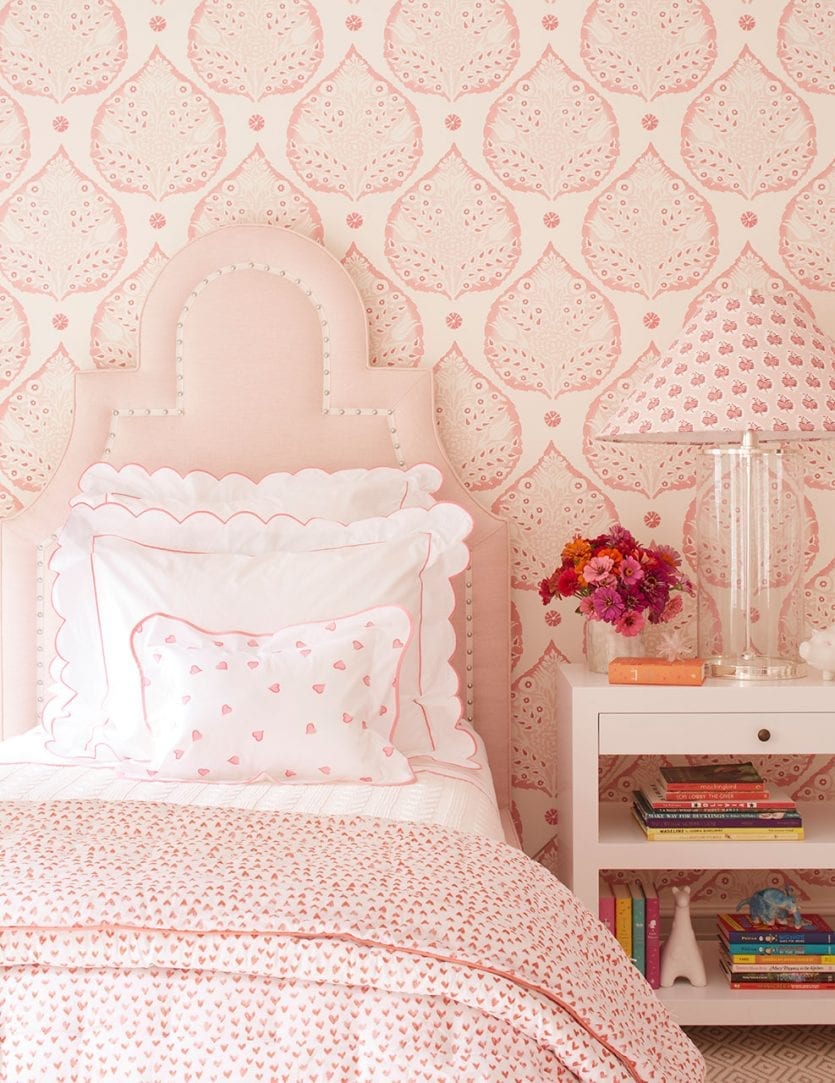 Pink girls bedroom with twin beds with block print wallpaper