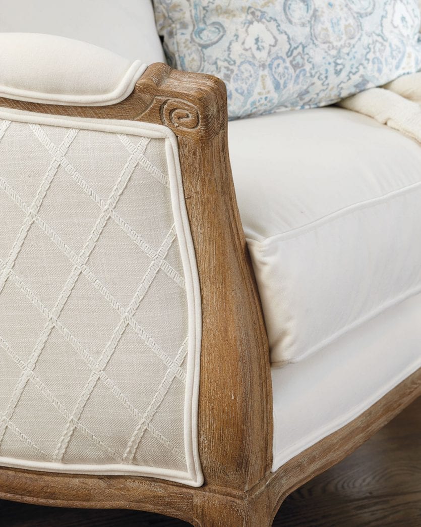 Two fabrics on sofia chair, a criss cross pattern on the outside and solid velvet on the inside