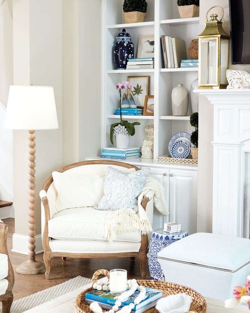 Ballard Designs Sofia Chair in corner of living room in front of bookshelves