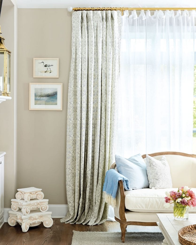 Sofia Settee in living room window with patterned drapes