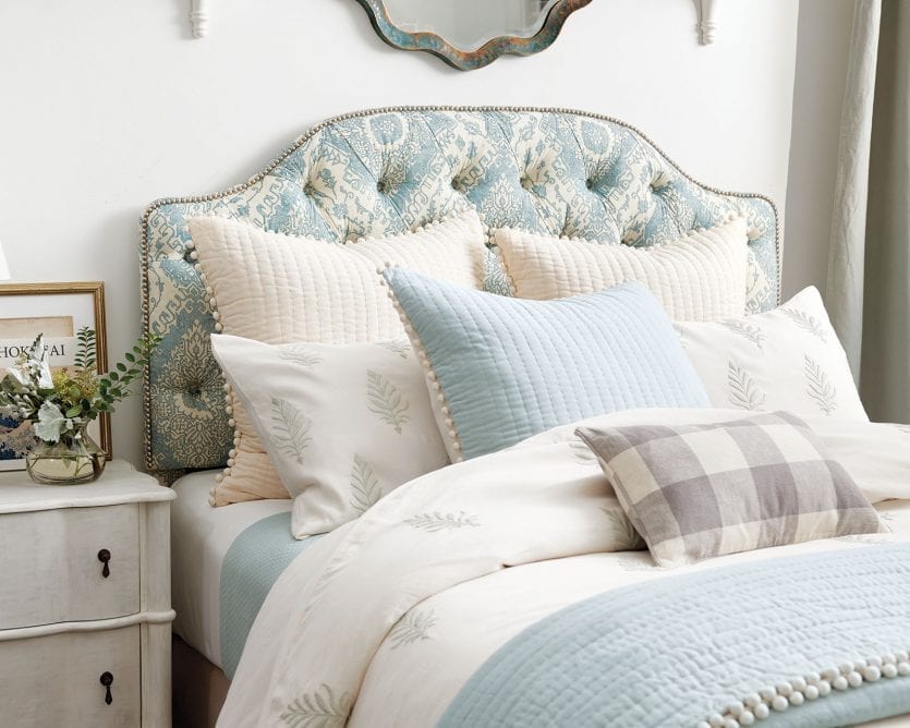 Upholstered fabric headboard in bedroom