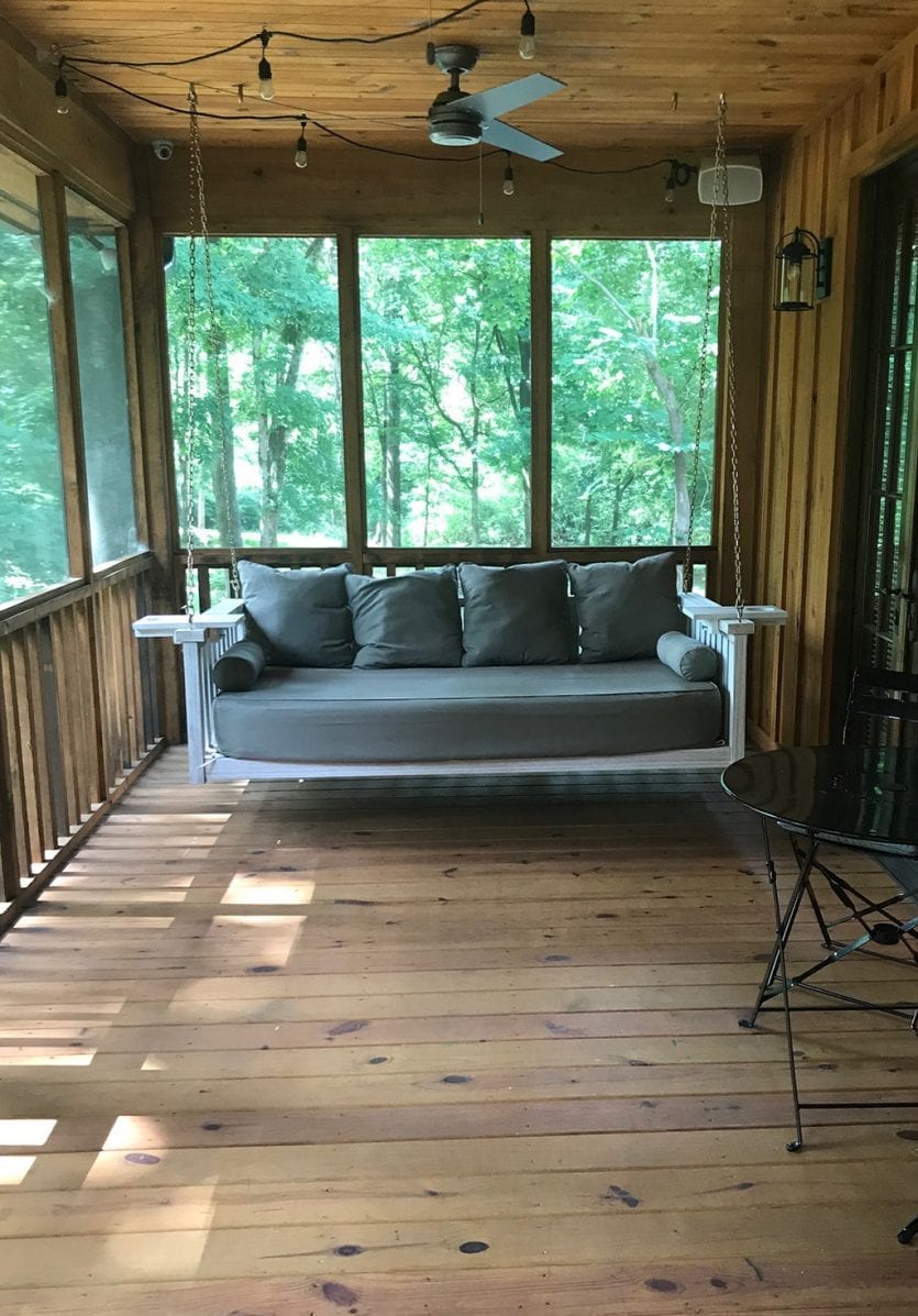 Sunday porch swing in Ryan's lake cabin