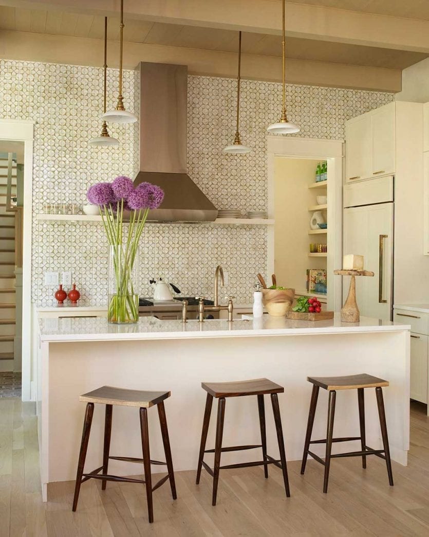 Open concept kitchen with island and tiled mosaic wall