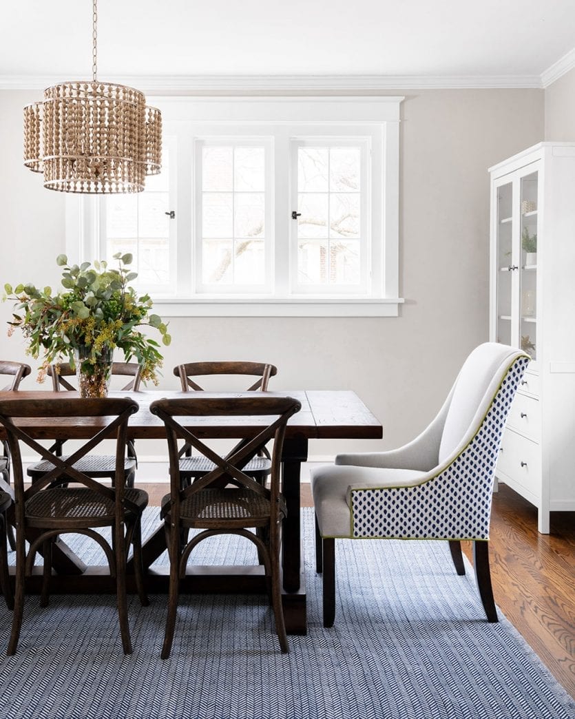 Breakfast room with mixed dining chairs and farm table designed by Kimberly Barr