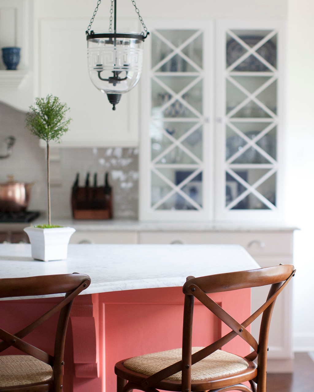 Kitchen designed by Jennie Seward with coral kitchen island