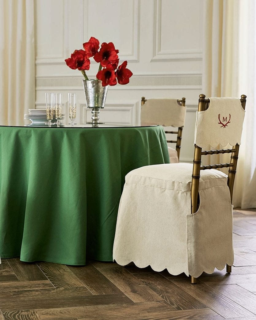 Folding party table with tablecloth and folding ballroom chairs for an easier holiday party