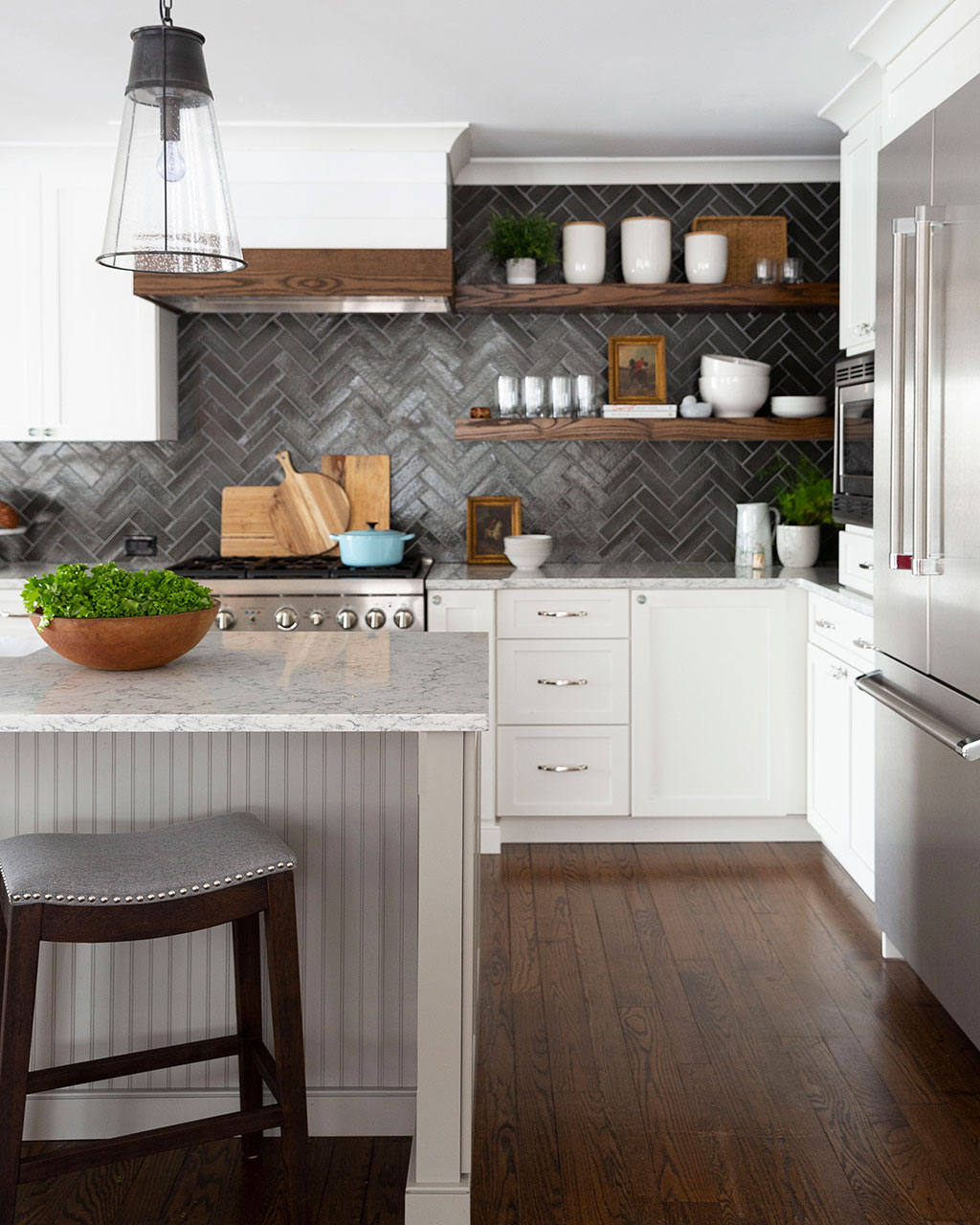 White kitchen with dark backsplash designed by Lisa Furey