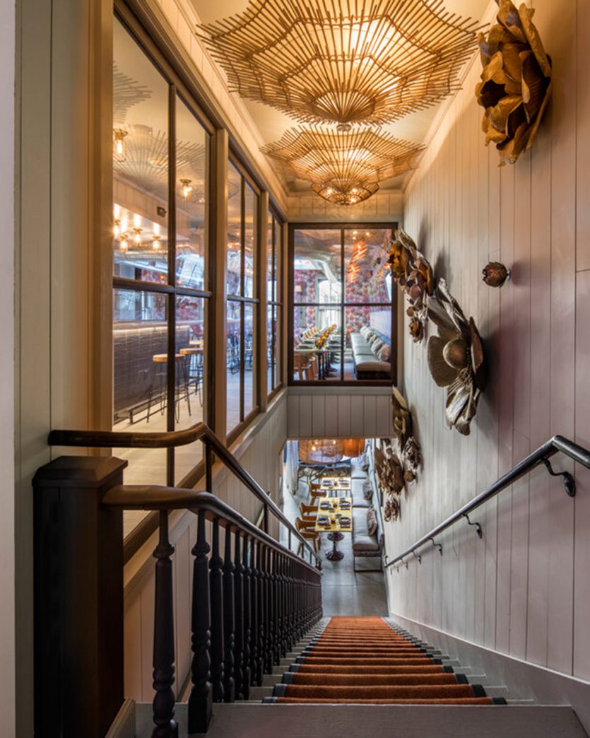 Staircase with sculpture at Elephant and Dove restaurant designed by Thom Filicia