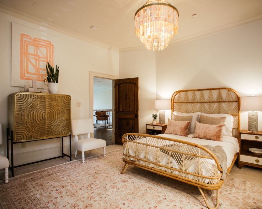 Neutral bedroom with vintage wicker bed designed by Jade Joyner