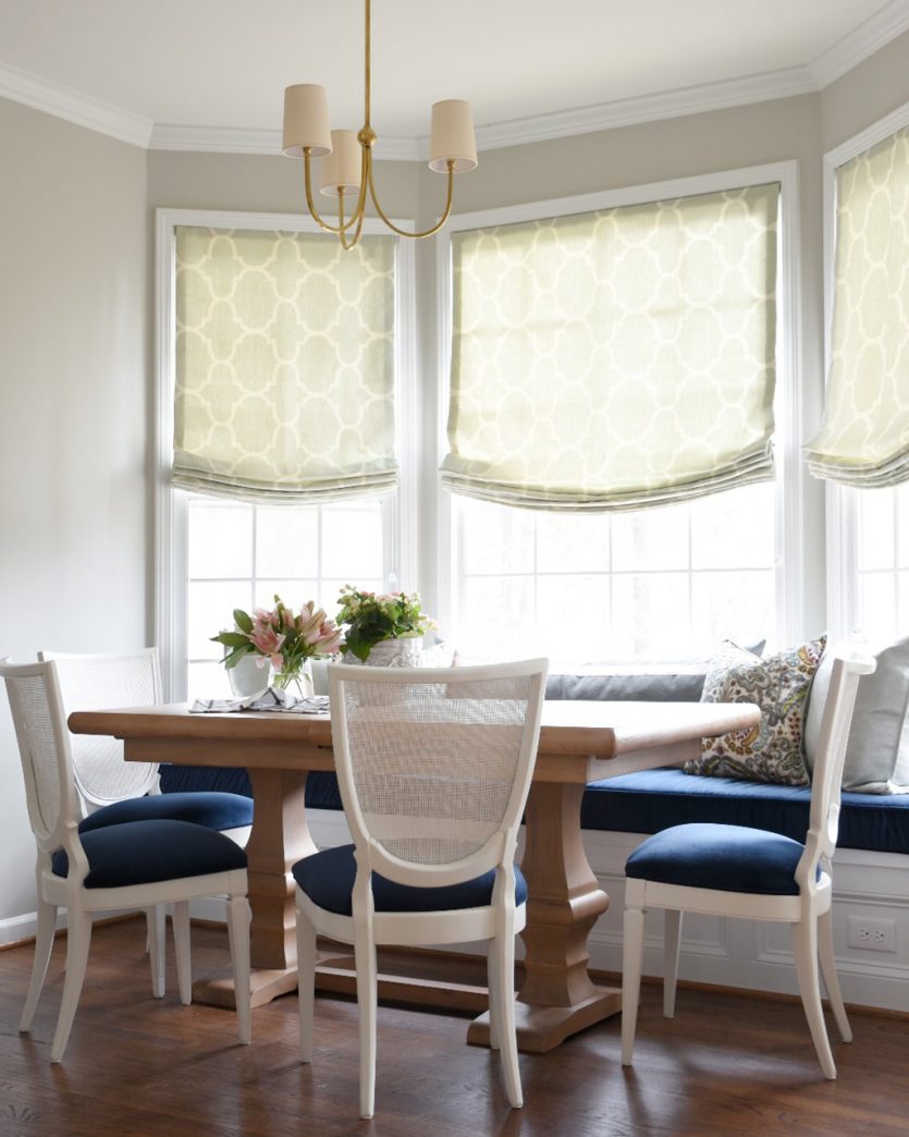 Light and airy dining room with wood dining table designed by Gordon Dunning