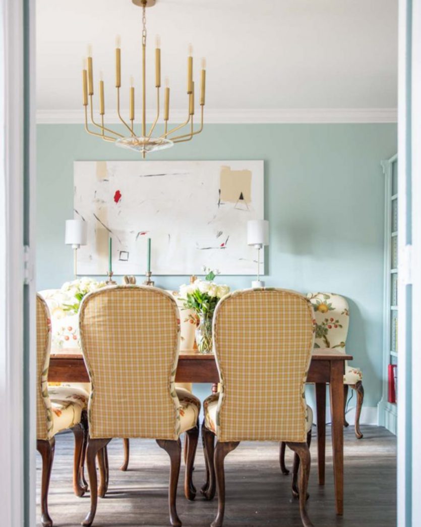 Blue dining room with neutral traditional dining chairs designed by Kevin O'Gara