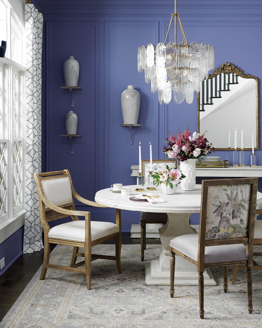 Acrylic wall brackets lend a modern twist to a classic dining room