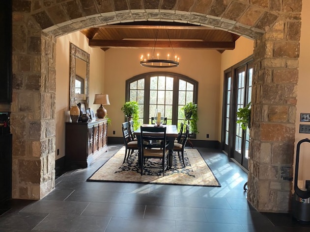 Dining room with dark wood ceilings