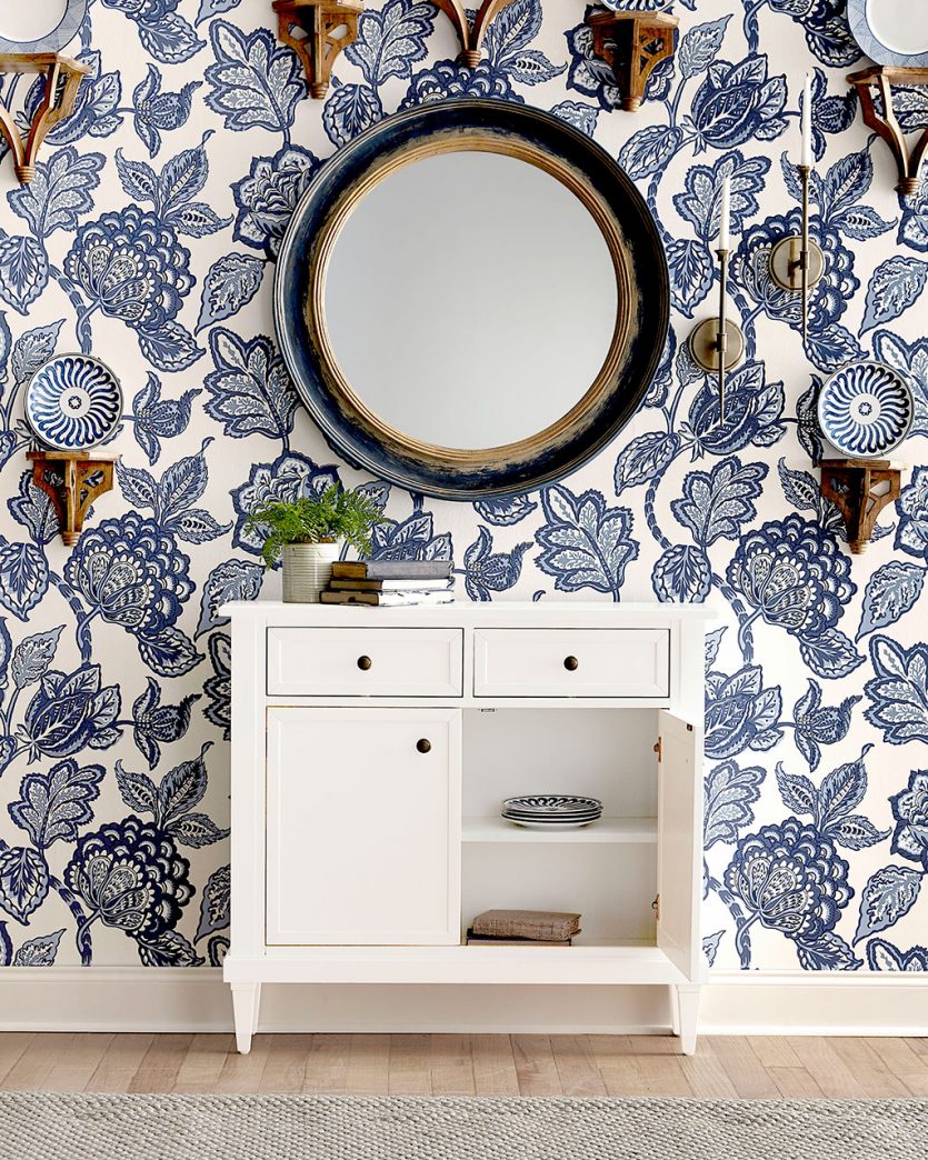 Slim storage cabinet in blue and white entryway