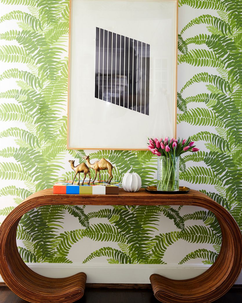 Entryway with green fern wallpaper and vintage console designed by Barrie Benson