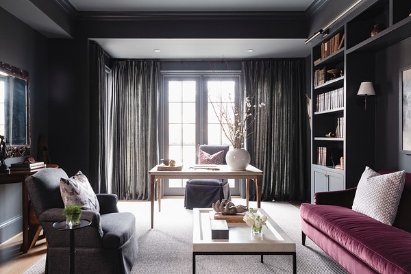 Home office with dark walls and jewel toned accents designed by Dana Wolter