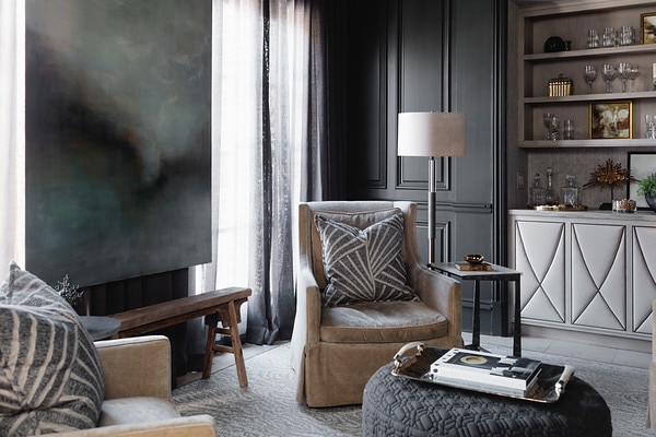 Dark living room designed by Dana Wolter with large painting