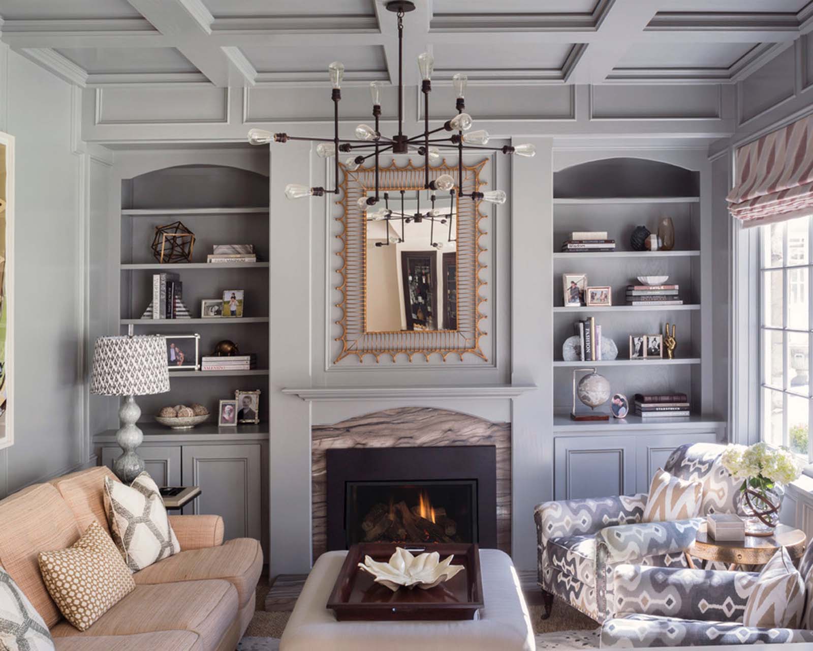 Gray library with wood paneling designed by Masucco Warner